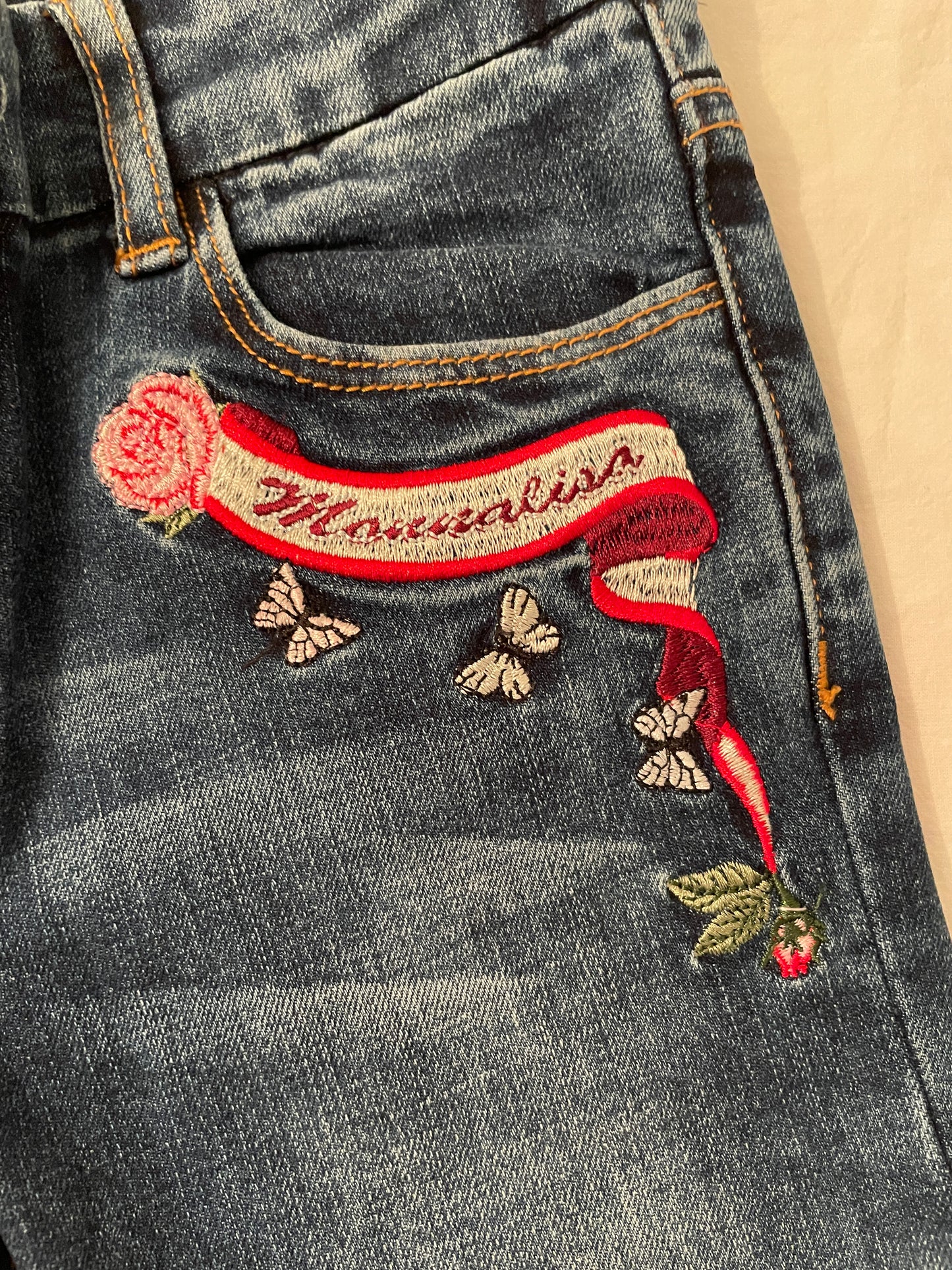 Embroidered five-pocket jeans