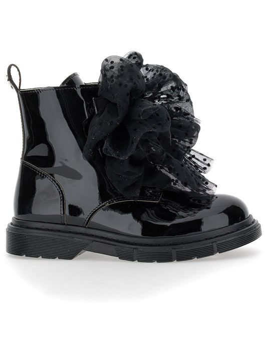 Leather amphibians with tulle bows