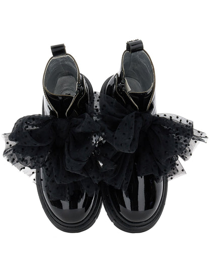 Leather amphibians with tulle bows