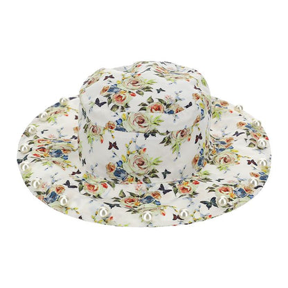 Hat with pearls on the brim